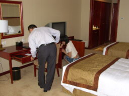 Security staff carrying out a room search